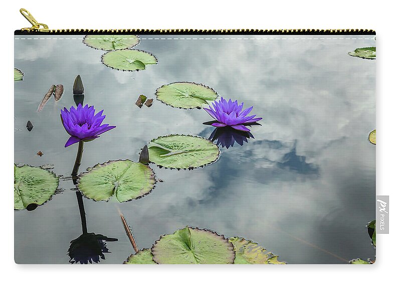Lily Zip Pouch featuring the photograph Purple Water Lilies and Pads by Cate Franklyn