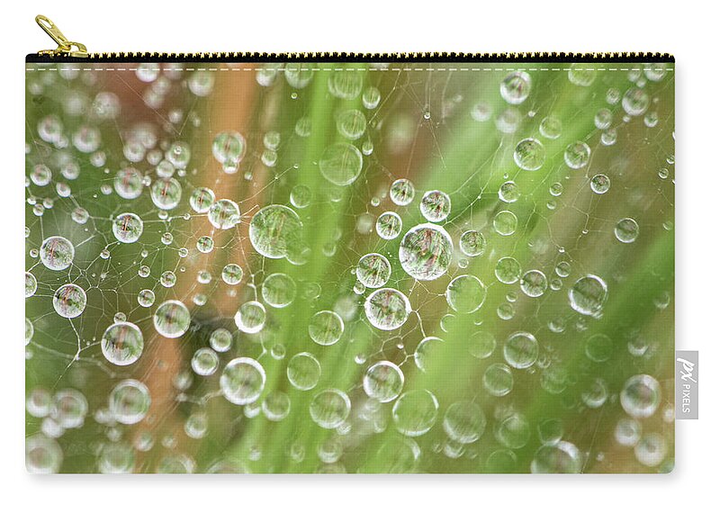 Rain Carry-all Pouch featuring the photograph Raindrops On A Web Net by Karen Rispin