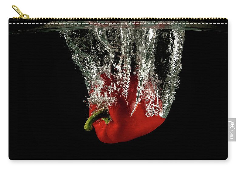 Pepper Zip Pouch featuring the photograph Red bell pepper dropped and slashing on water by Michalakis Ppalis