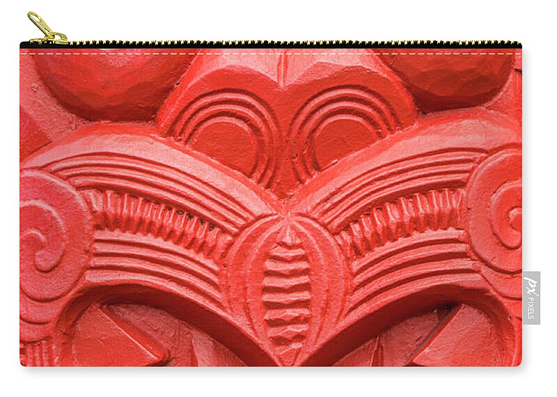 Rotorua Zip Pouch featuring the photograph Red Maori carving, Whakarewarewa, New Zealand by Neale And Judith Clark