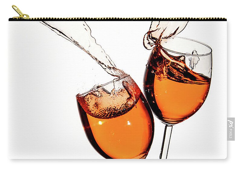 Alcohol Carry-all Pouch featuring the photograph Red wine in glasses with splashes on a white background isolated by Michalakis Ppalis