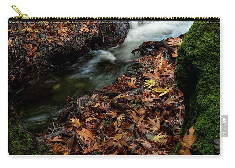 Waterfall Zip Pouch featuring the photograph River flowing with maple leaves on the rocks on the riverside in autumn season by Michalakis Ppalis