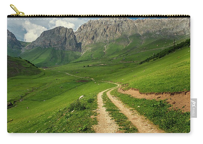 Mountain Zip Pouch featuring the photograph Road in mountains by Mikhail Kokhanchikov