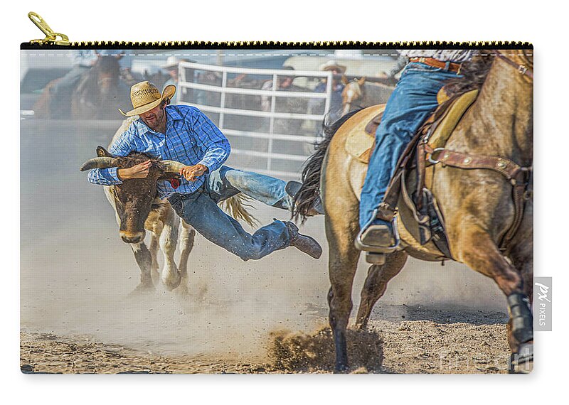 Rodeo Zip Pouch featuring the photograph Rodeo Cowboy Wrestling a Steer by Diane Diederich