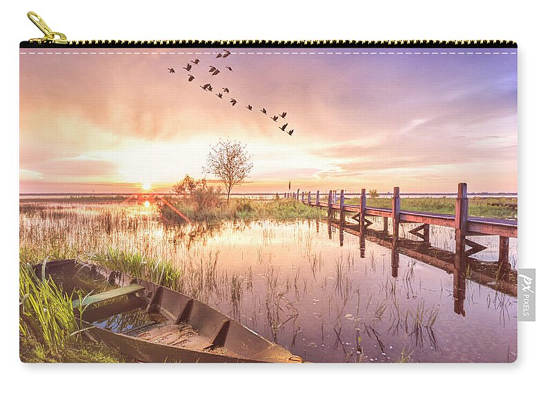 Birds Zip Pouch featuring the photograph Rowboat in the Marsh in Soft Light at Sunset by Debra and Dave Vanderlaan