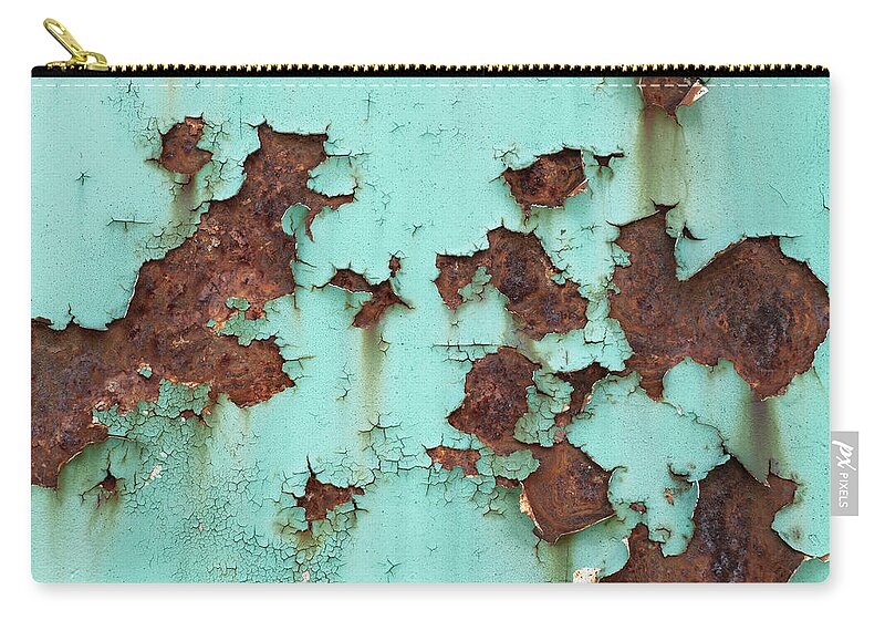 Metal Zip Pouch featuring the photograph Rusty Metal Background With Peeling Paint by Artur Bogacki