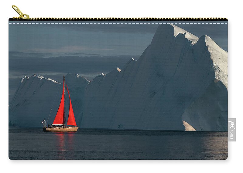 Greenland Zip Pouch featuring the photograph Sailboat in the low setting sun in Greenland by Anges Van der Logt