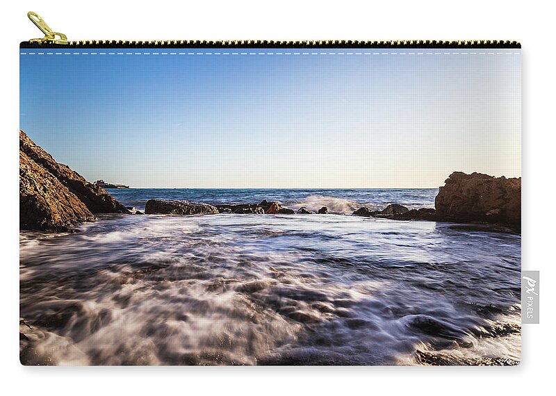 Beach Zip Pouch featuring the photograph Seascape at sunset with waves by Fabiano Di Paolo