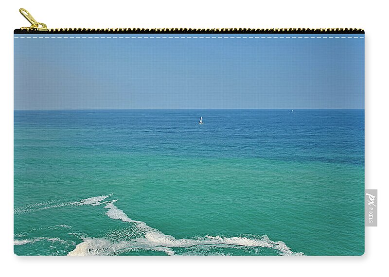 Shades Of Blue Zip Pouch featuring the photograph Shades of blue in the Bay of Biscay by Monika Salvan