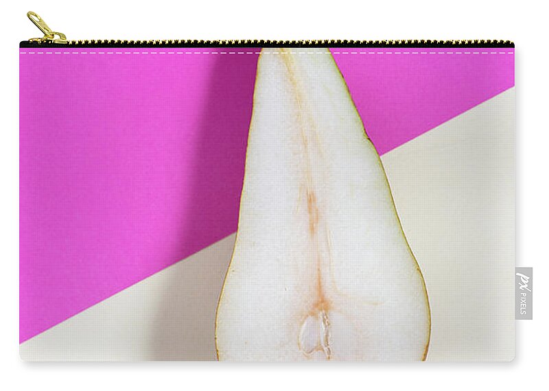 Still-life Zip Pouch featuring the photograph Slice of healthy pear fruit on a colourful background. by Michalakis Ppalis