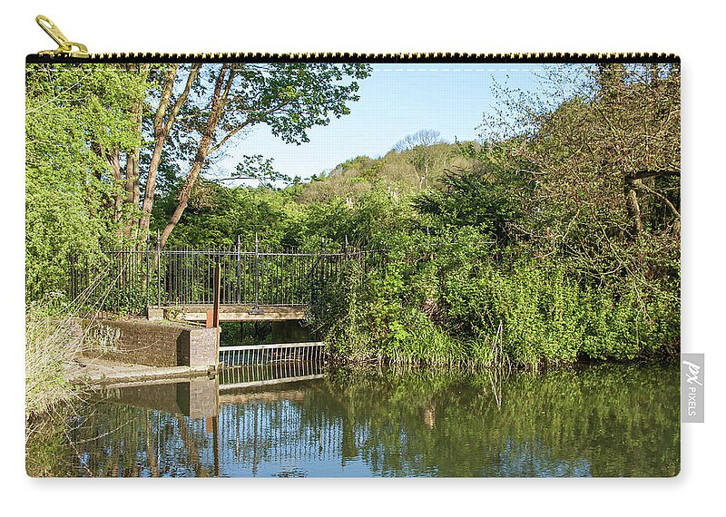 Sluice Zip Pouch featuring the photograph Sluice gate on a tranquil pool by Average Images