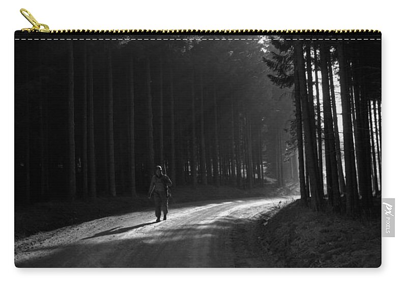 Battle Of The Bulge Zip Pouch featuring the photograph Soldier Walking Through The Forest - Battle Of The Bulge - 1944 by War Is Hell Store