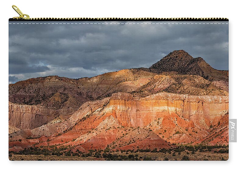 Ghost Ranch Zip Pouch featuring the photograph Storm above Ghost Ranch Mountains by Kathleen Bishop