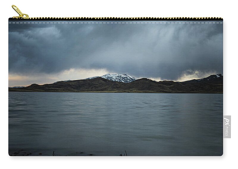 Mountains Carry-all Pouch featuring the photograph Storm Over Wildhorse by Ron Long Ltd Photography