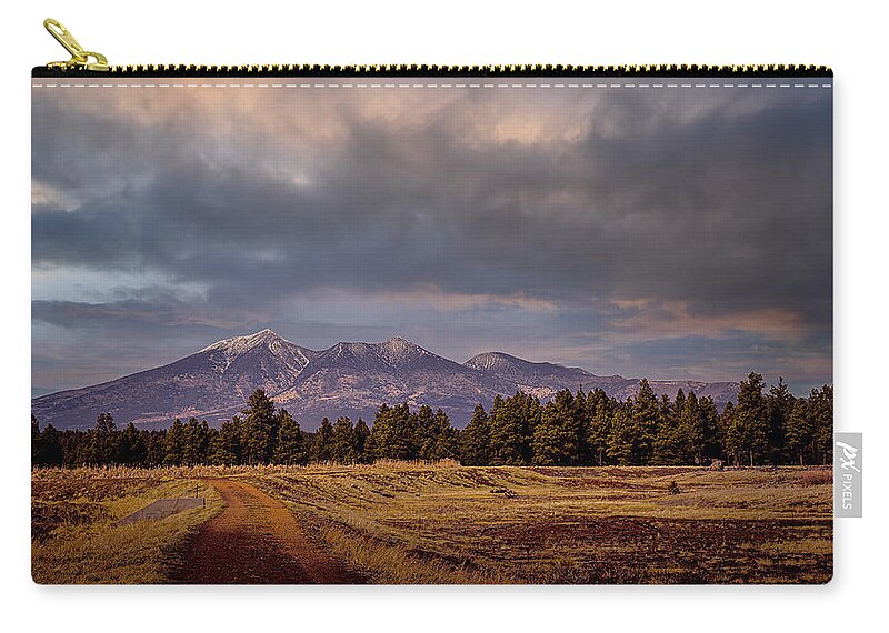 Wetlands Carry-all Pouch featuring the photograph Stormy Skies by Laura Putman