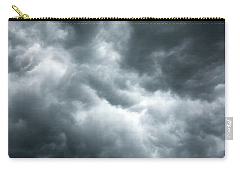 Clouds Zip Pouch featuring the photograph Stormy clouds in the sky. by Bernhard Schaffer