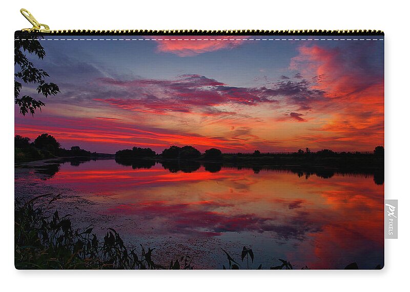 Summer Sunset On The River Zip Pouch featuring the photograph Summer sunset on the river by Lynn Hopwood