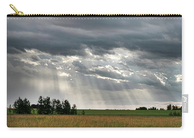 Sun Zip Pouch featuring the photograph Sun rays over a field by Phil And Karen Rispin