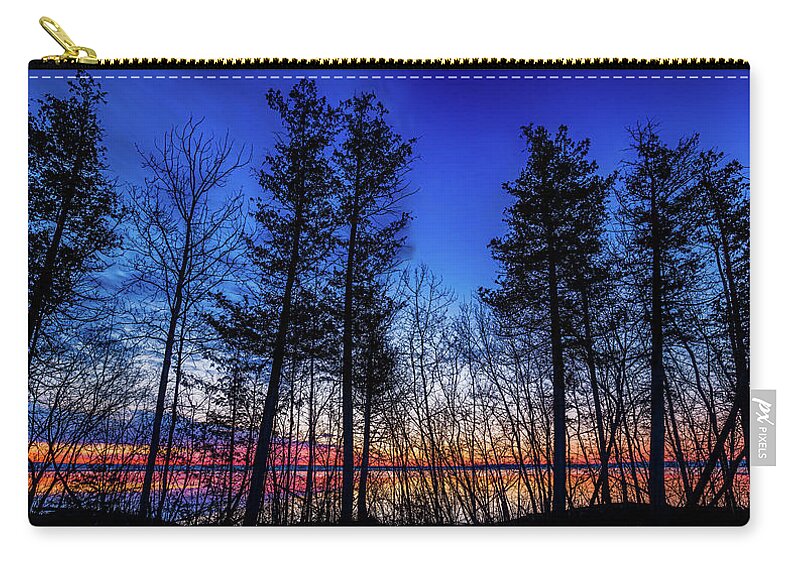 Trees Zip Pouch featuring the photograph Sunrise through the trees by Joe Holley
