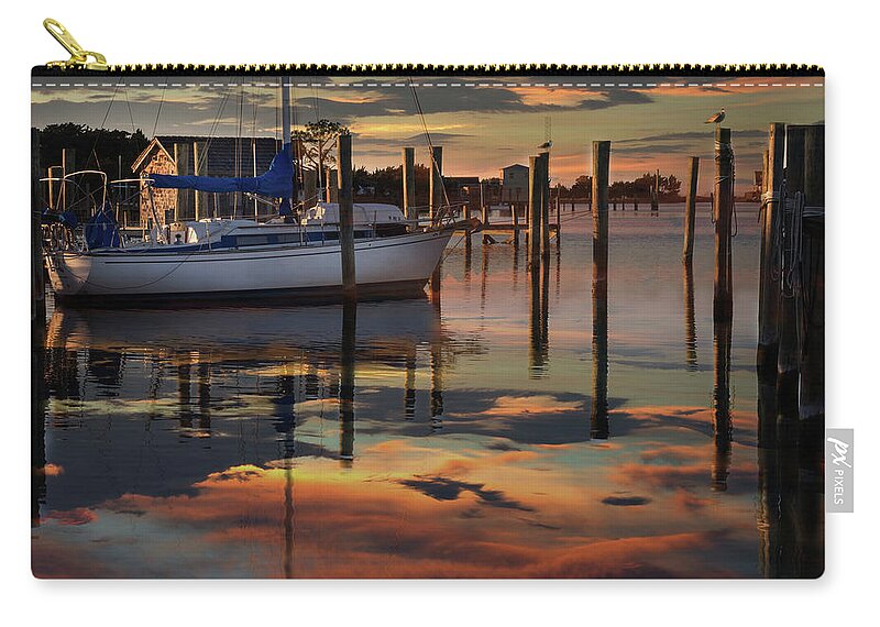Sunset At Ocracoke Pier Zip Pouch featuring the photograph Sunset at Ocracoke Pier by James C Richardson
