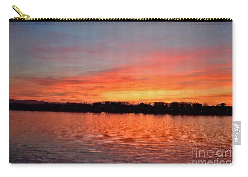 Nature Zip Pouch featuring the photograph Sunset draped in vermilion over the river by Leonida Arte