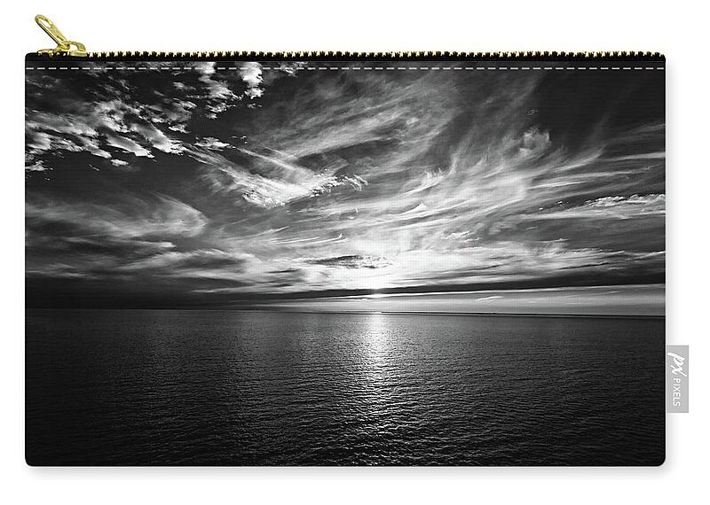 Sunset Zip Pouch featuring the photograph Sunset on the horizon at sea by Bernhard Schaffer