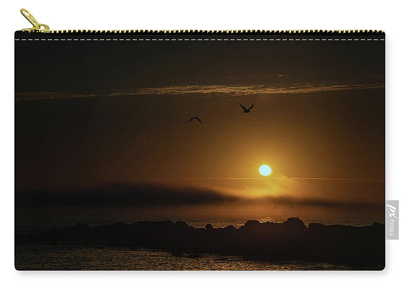 Sunset Carry-all Pouch featuring the photograph Sunset over the ocean by Micah Offman