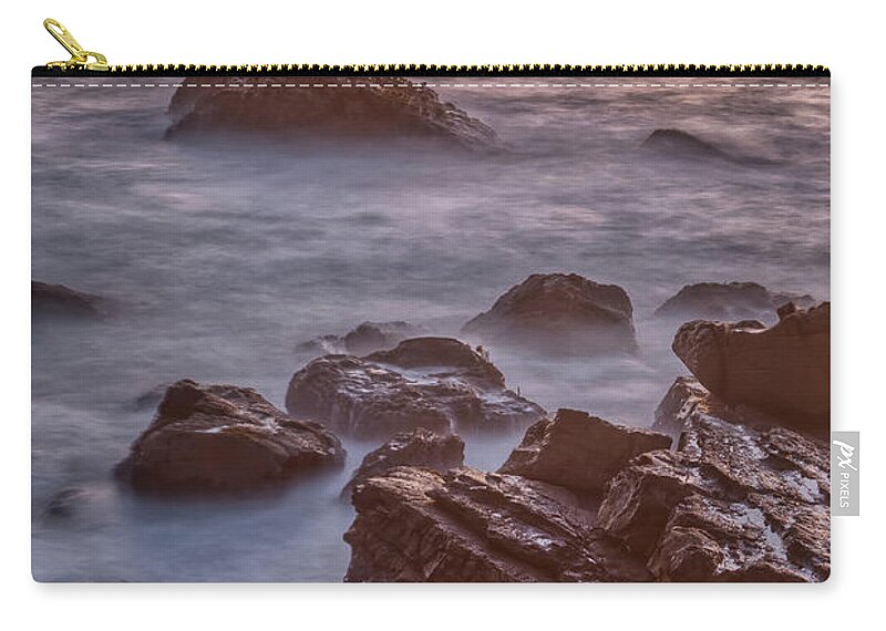Ocean Cove Zip Pouch featuring the photograph Surf and Rocks at Dusk by Jurgen Lorenzen