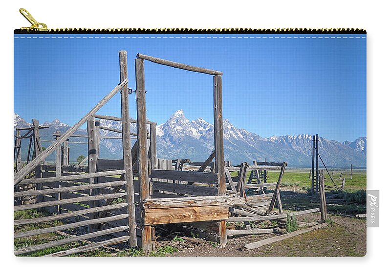 Wyoming Zip Pouch featuring the photograph Teton Fencepost by Ed Stokes