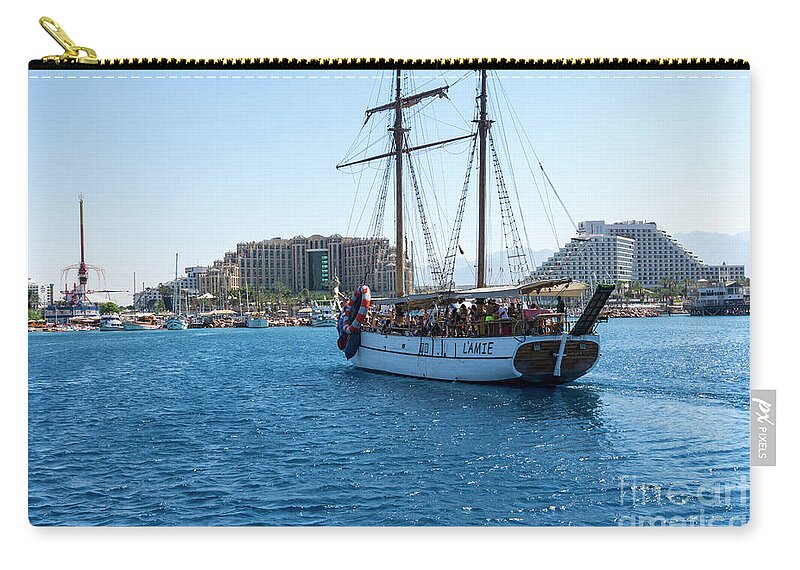 Gulf Of Aqaba Zip Pouch featuring the photograph The excursion boat L'Amie cruises in the Gulf of Aqaba off the r by William Kuta