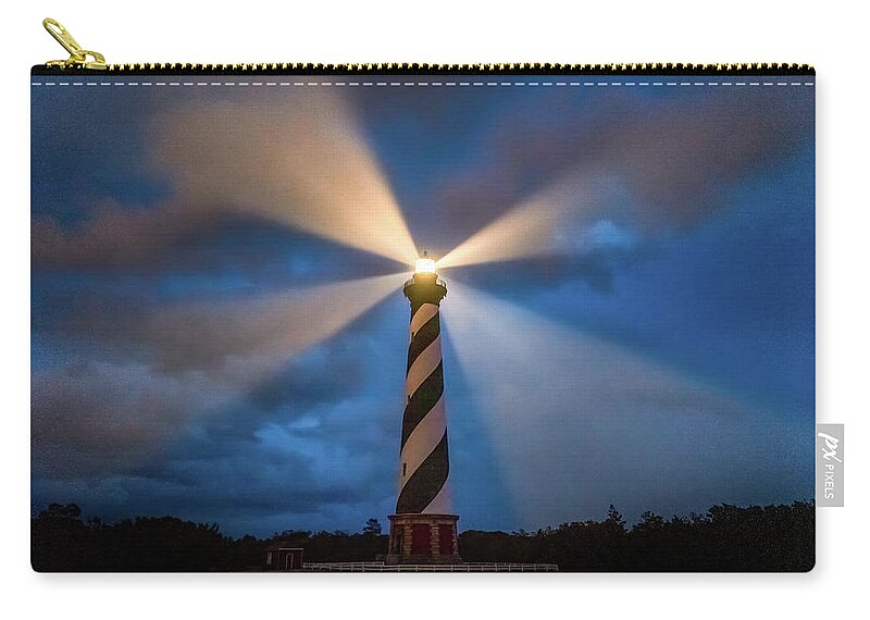North Carolina Zip Pouch featuring the photograph The guiding light by Robert Miller