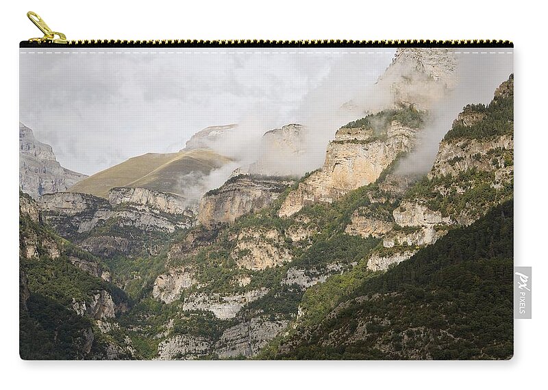 Anisclo Canyon Zip Pouch featuring the photograph The Last of the morning mist in the Anisclo Canyon by Stephen Taylor