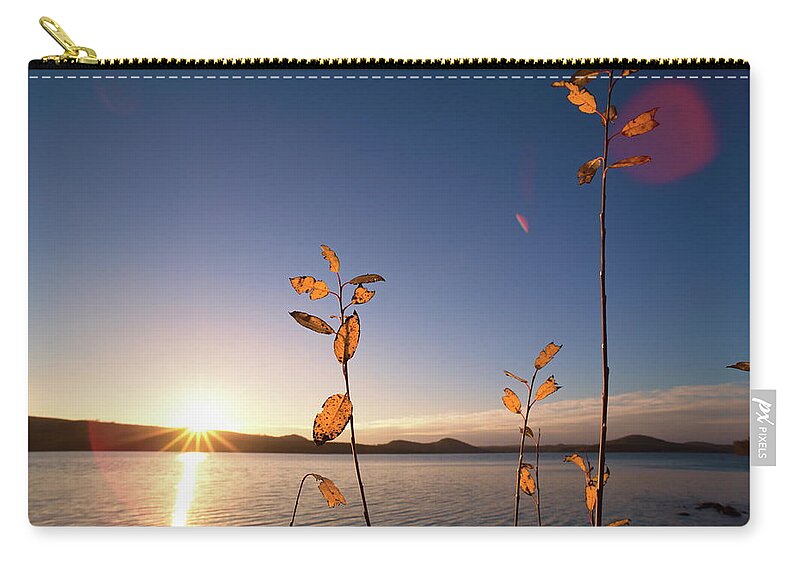 Europe Zip Pouch featuring the photograph The sun is rising over a lake in fall - wide angle by Ulrich Kunst And Bettina Scheidulin