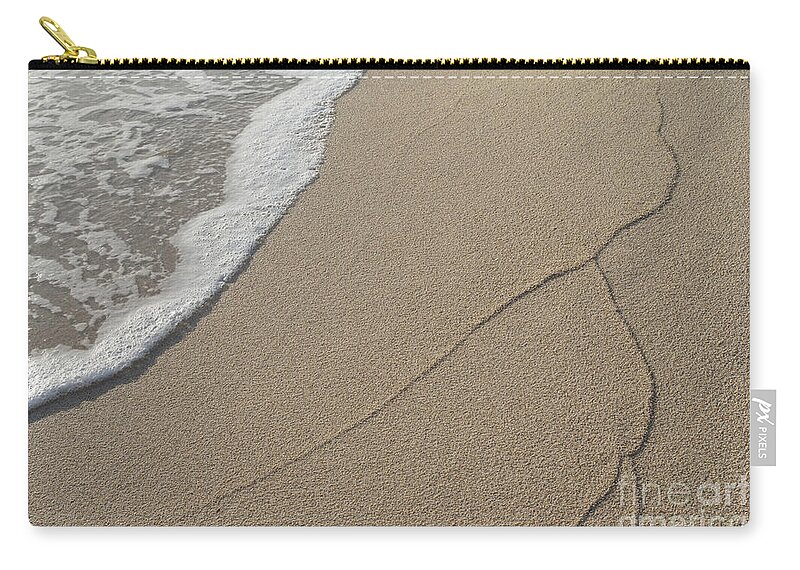 Mediterranean Coast Zip Pouch featuring the photograph Traces of waves on the sandy beach. Sea water meets beige sand 2 by Adriana Mueller