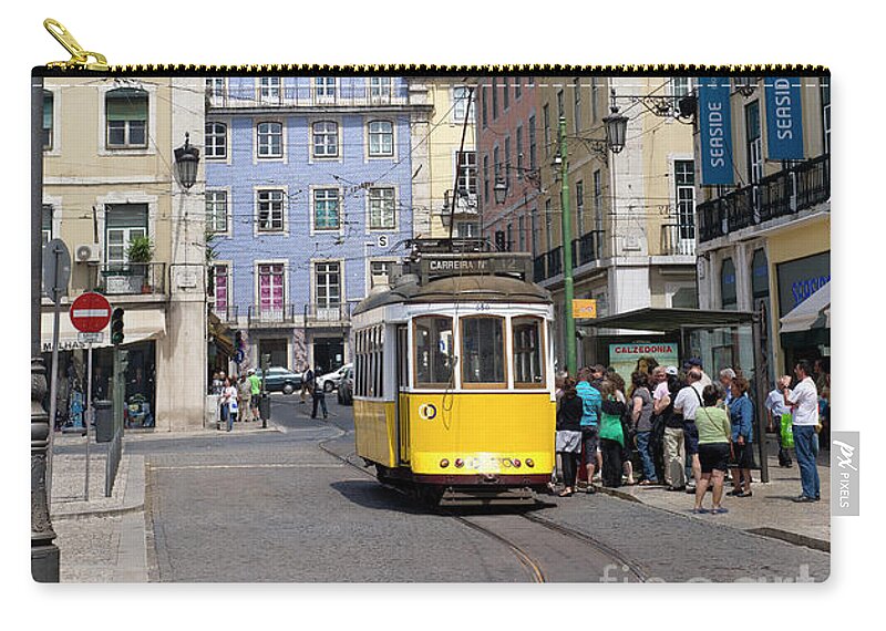 Portugal Zip Pouch featuring the photograph tramcar in Praca da figueira, Lisboa by Mikehoward Photography