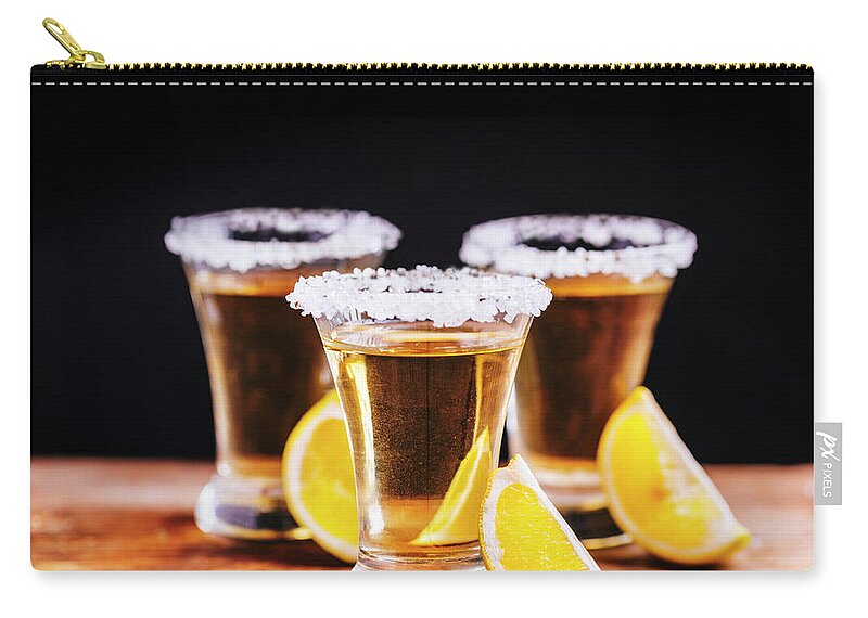 Tequila Zip Pouch featuring the photograph Tree shot glasses of Mexican tequila cocktail with lemon slices by Jelena Jovanovic