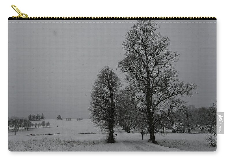 Herts Zip Pouch featuring the photograph Trees in a snow storm by Andrew Lalchan