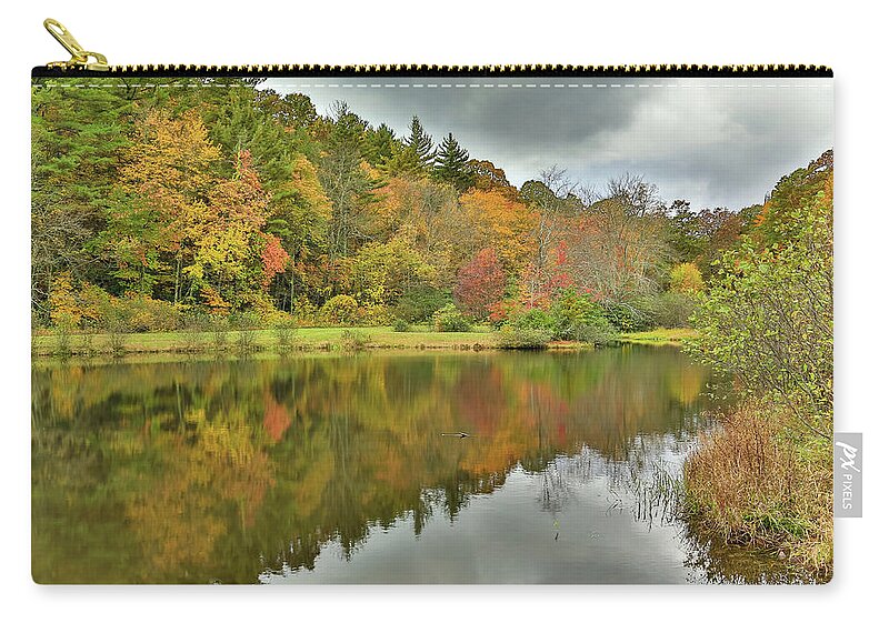 Pond In Autumn Zip Pouch featuring the photograph Triangle Lake by Steve Templeton