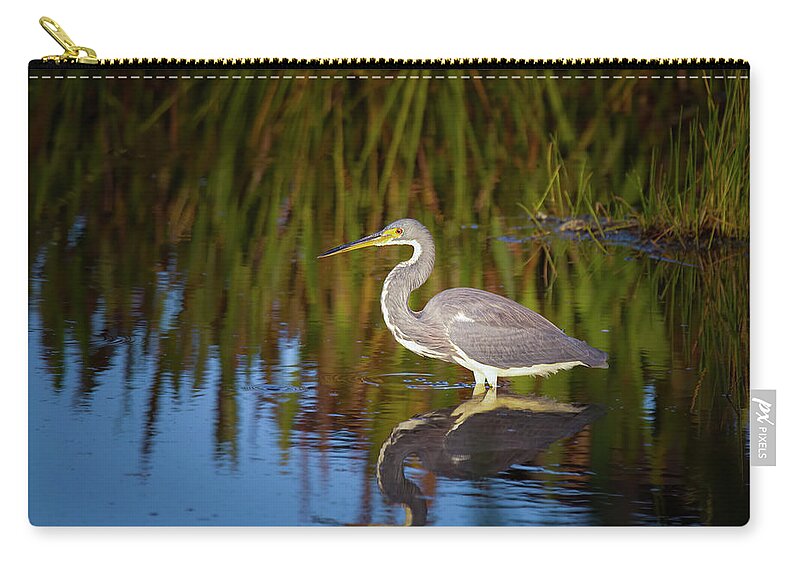 Tricolor Heron Zip Pouch featuring the photograph Tricolored Heron Enjoys the Sunset by Mark Andrew Thomas