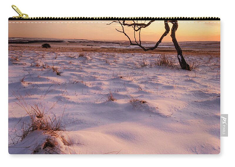 One Tree Zip Pouch featuring the photograph Twisted tree in the snow at sunset, Peak District National Park, Derbyshire, England by Neale And Judith Clark