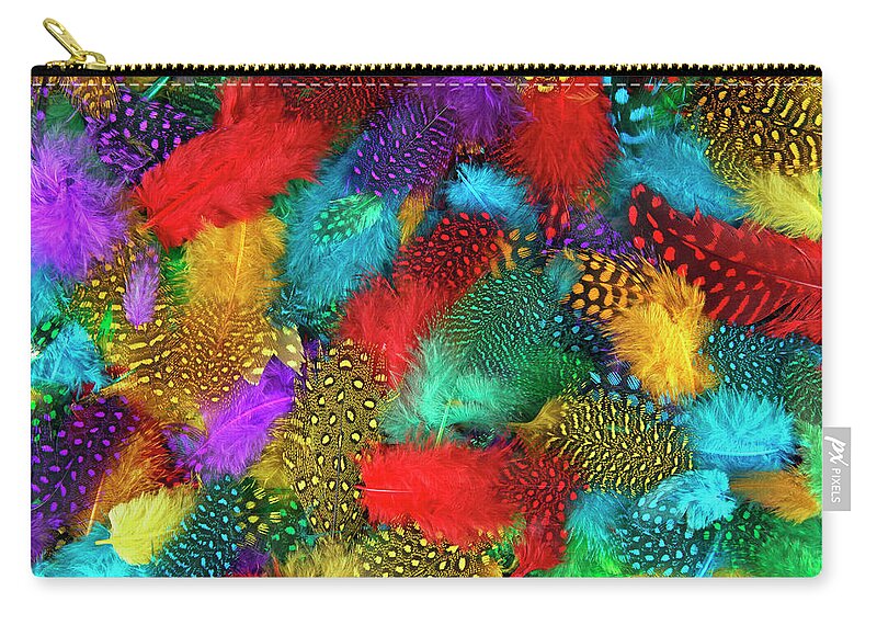 Feathers Zip Pouch featuring the photograph Various color feather background by Severija Kirilovaite