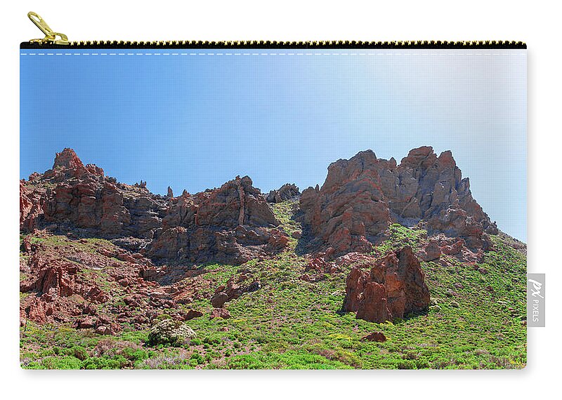 Mountains Zip Pouch featuring the photograph Vegetation surrounding red lava rocks by Sun Travels