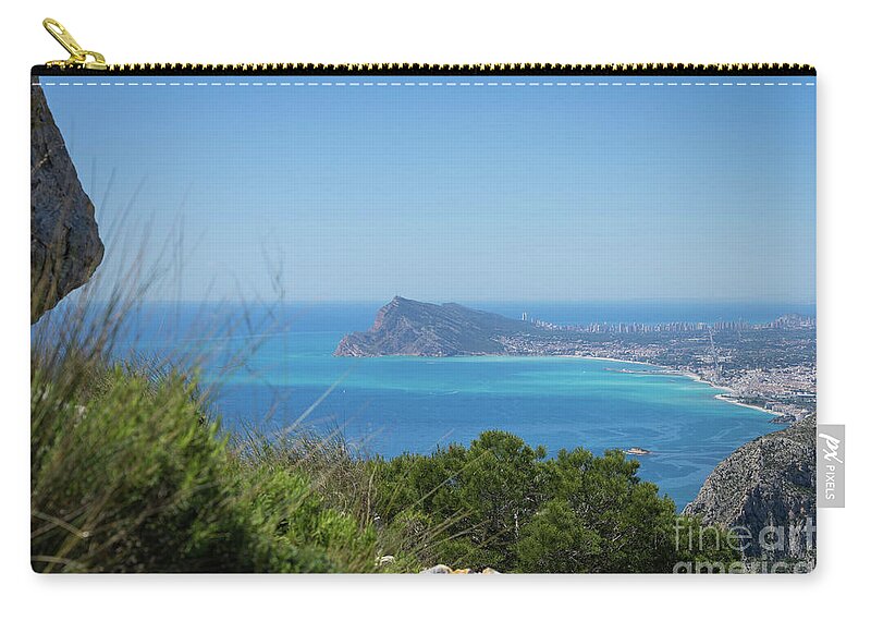 Spain Carry-all Pouch featuring the photograph View of the coast and the Mediterranean sea in Benidorm by Adriana Mueller