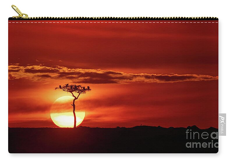 Sunset Zip Pouch featuring the photograph Vultures in silhouette perched in a tree against the setting sun. Red sky sunset in the Masai Mara, Kenya by Jane Rix