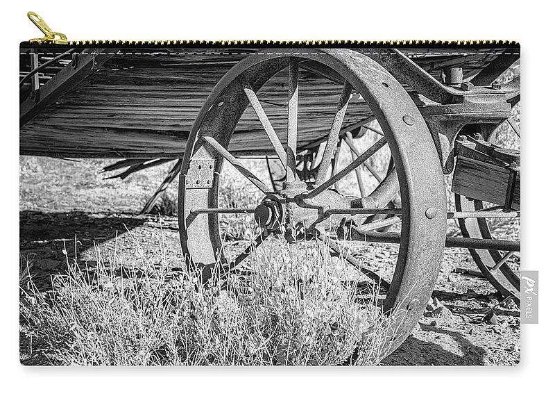Wagon Zip Pouch featuring the photograph Wagon Wheel BW by Joan Carroll