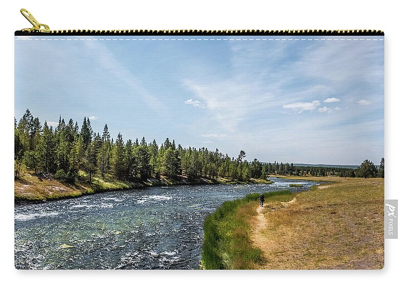 Yellowstone Zip Pouch featuring the photograph Walking along the river by Alberto Zanoni