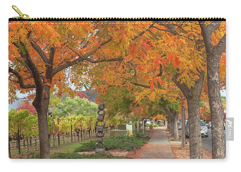 Chinese Pistache Zip Pouch featuring the photograph Walking Under The Red Trees by Jonathan Nguyen