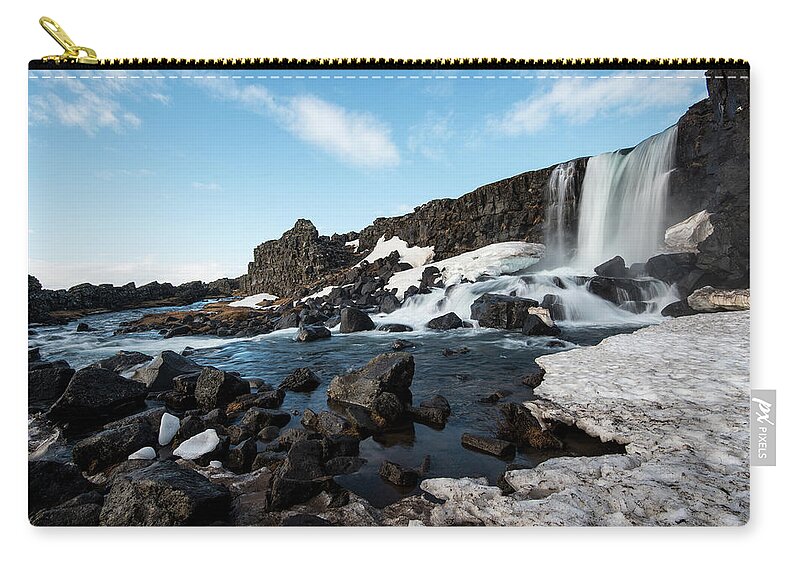 Oxararfoss Zip Pouch featuring the photograph Waterfall flowing into the river, Iceland by Michalakis Ppalis