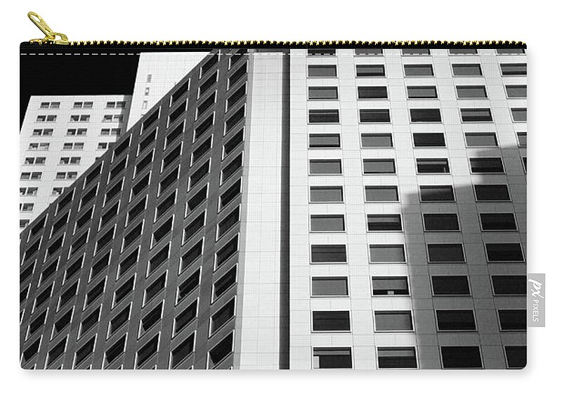 White Zip Pouch featuring the photograph White Building in Black and White by Katherine Erickson