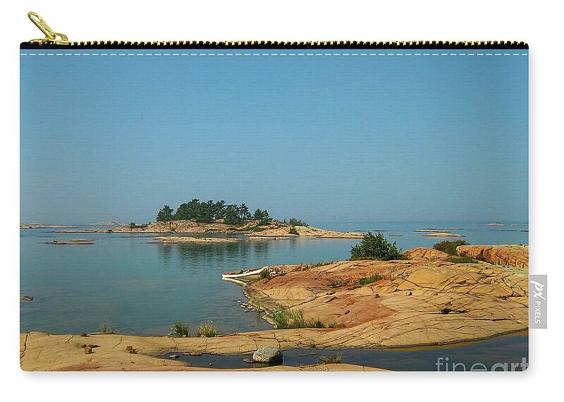 White Zip Pouch featuring the photograph White canoe on the shore of Georgian Bay in Ontario by Les Palenik